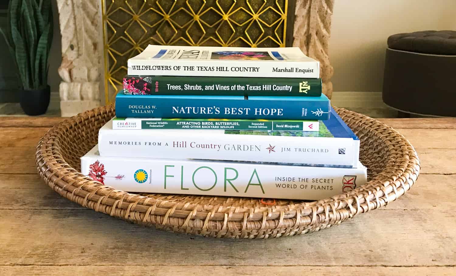 Native plant gardening books on coffee table