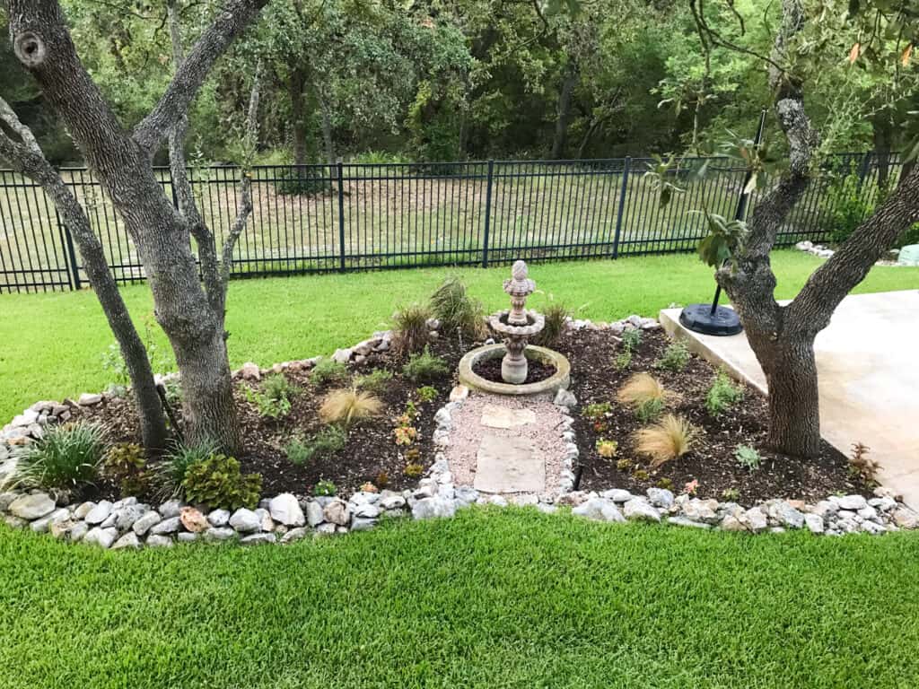 Native landscape design with a mix of Texas native plants and a few non-native plants.