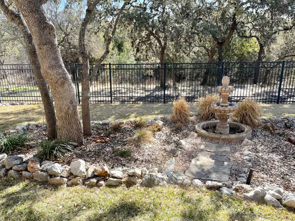 Landscaped beds with leaf mulch in winter.